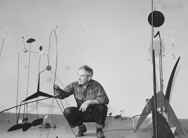 Publicity photograph of Calder during the installation of Alexander Calder. black and white