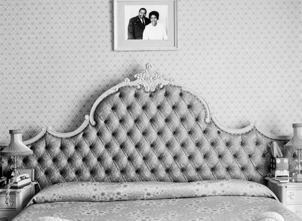 black and white photo of a bed 