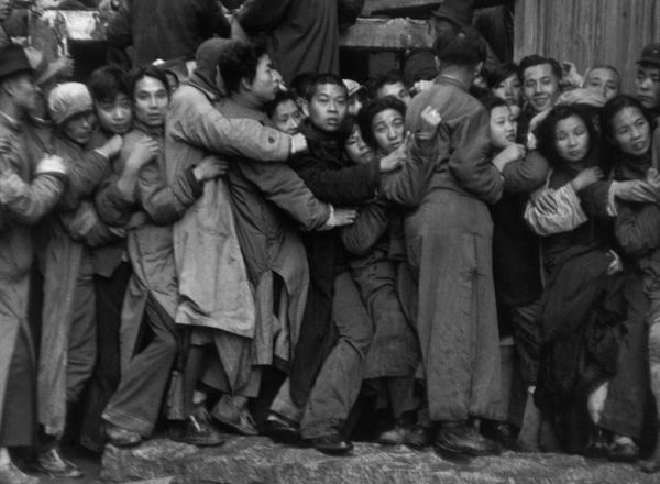 Gold Rush. At the end of the day, scrambles in front of a bank to buy gold. The last days of Kuomintang, Shanghai, 23 December 1948.