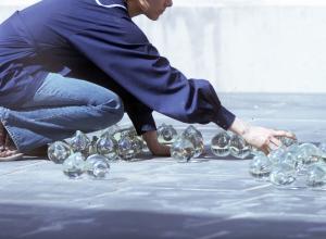 Kathleen Mulcahy installing Drops on a Landscape at Alfred University, Alfred, New York, 1973.
